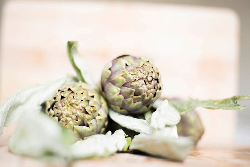 Fresh garlic bulbs on a wooden cutting board