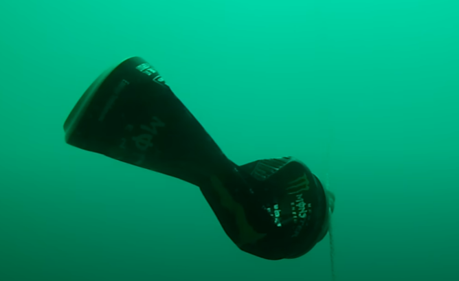 Energy drink can demonstrating underwater pressure