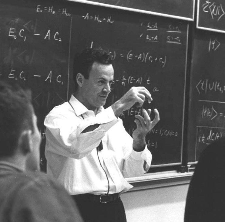 Feynman engaging with students in a physics class.