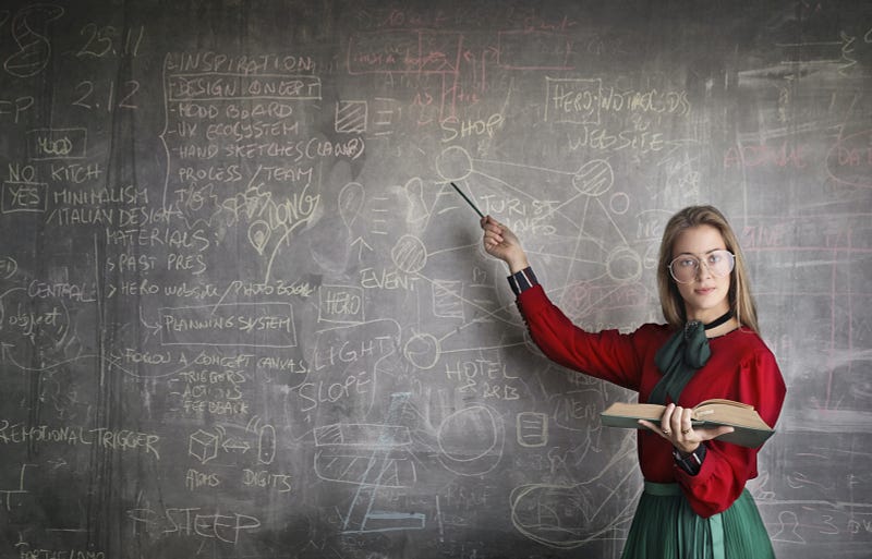 Educator inspiring students in a classroom setting.