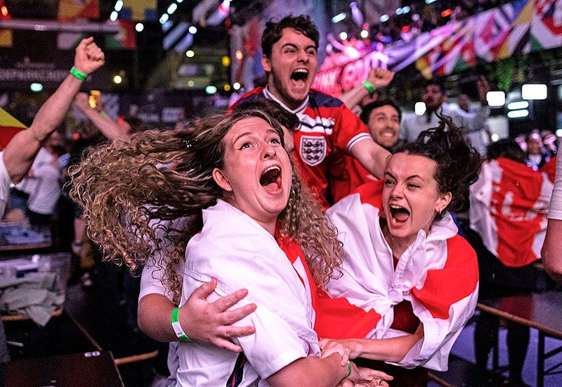 A passionate soccer fan cheering for their team